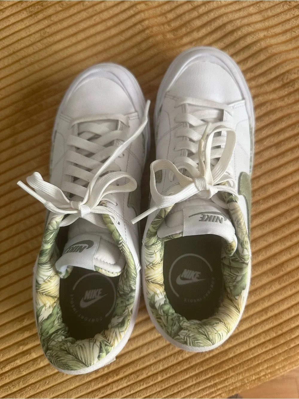 Nike Women's White Sneakers with Olive Swoosh and Leaf-Print Collar